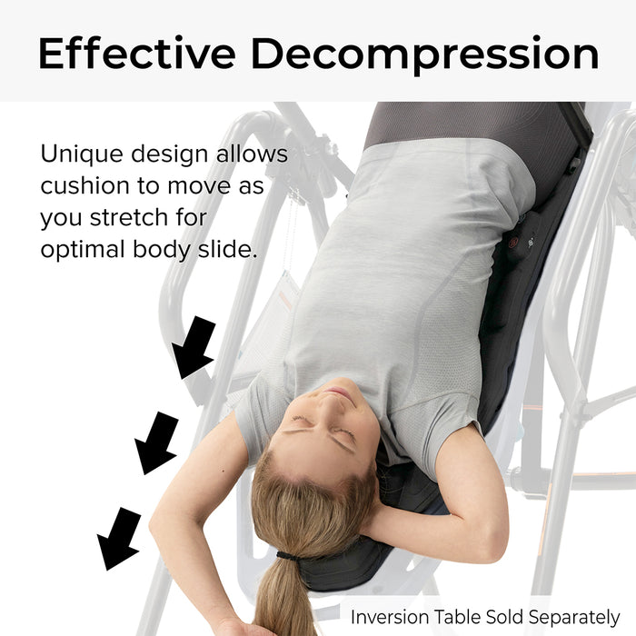 FitSpine Heat and Vibration Comfort Cushion by Teeter in use by woman in a grey shirt, with text "Effective Decompression - Unique design allows cushion to move as you stretch for optimal body slide."
