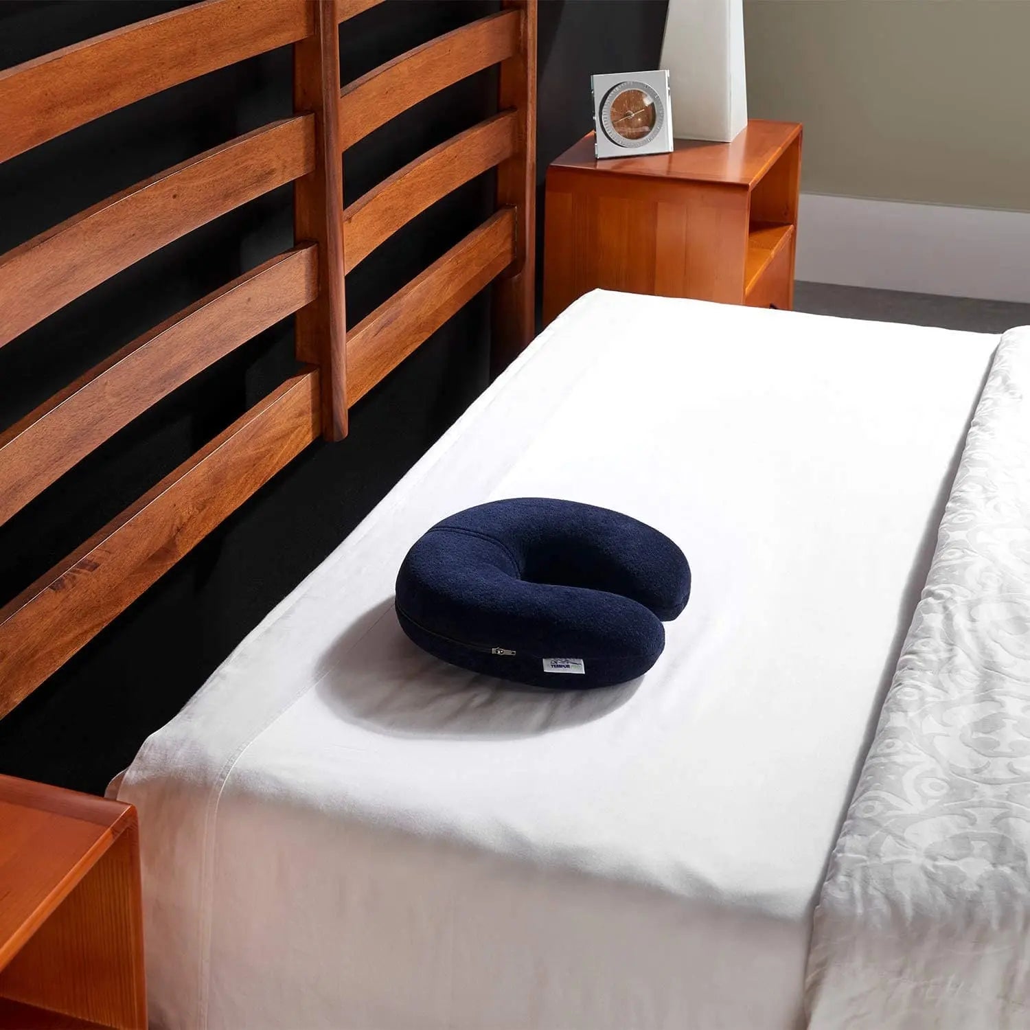 Tempur Pedic Travel Neck Pillow  shown on a bed
